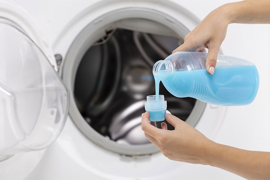 Pouring detergent to washing machine